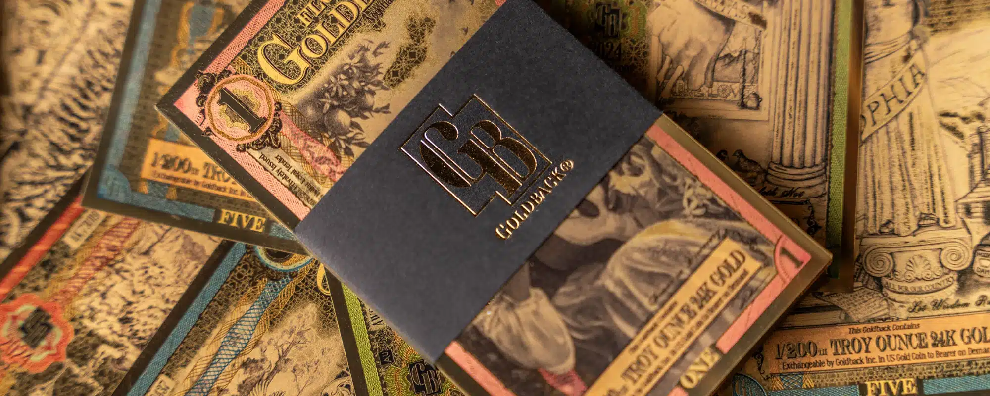 Goldback note and wallet display illustrating denomination-focused spendability